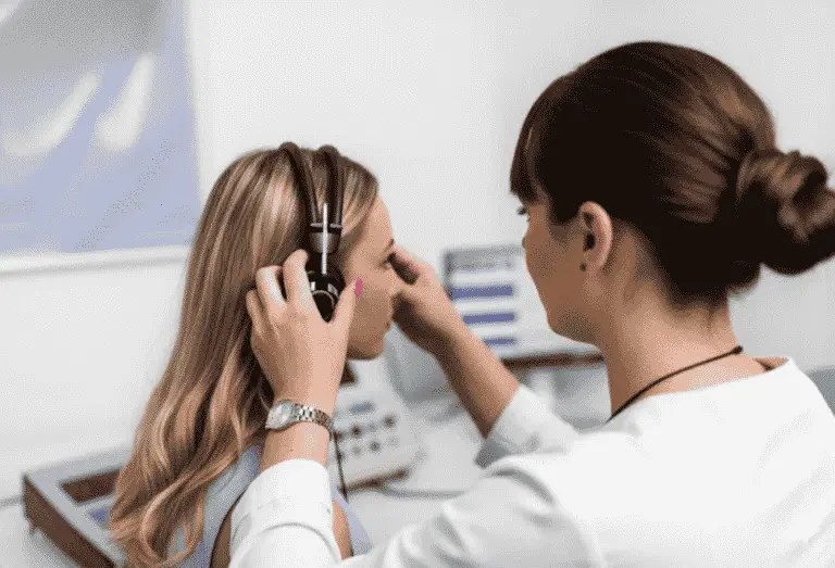 Audiologist performing a hearing test at EKG Hearing Care Clinic in CIT Nagar, Nandanam